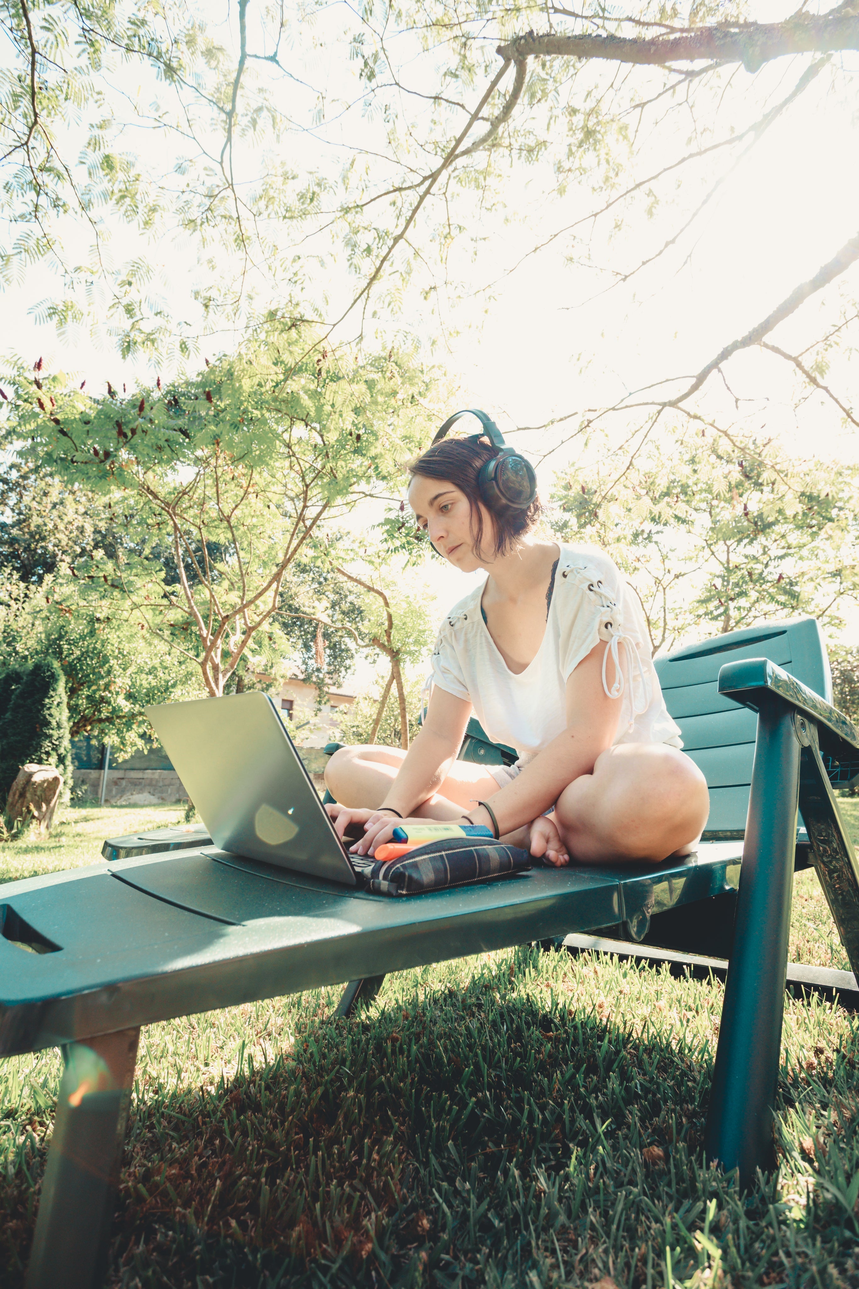 files/woman-works-on-her-laptop-outdoors-in-green-lawn-chair.jpg
